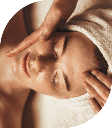 woman receiving facial massage
