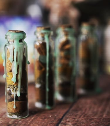 Image of small glass jars covered in green wax