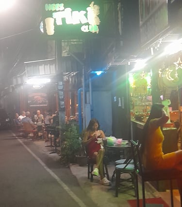 Thai women sat outside Ness Tiki Club in Hua Hin