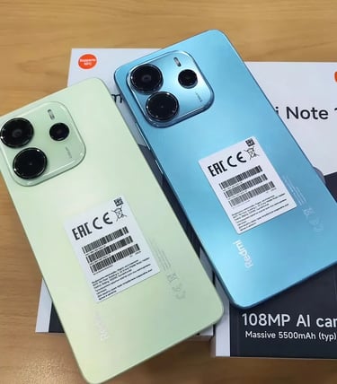 a couple of iphones sitting on top of a box