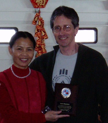Bob receiving 10 year award from GrandMaster Aiping Cheng in 2008.