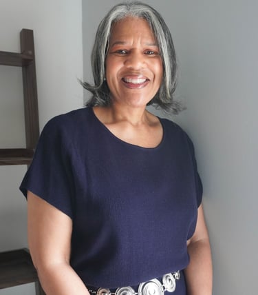 a woman with grey hair and a belt belt