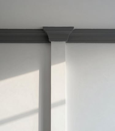 Symmetrical architectural portrait of a pristine white interior wall meeting crisp dark grey trim, sharp-line tape being peeled back cleanly, bright natural morning light, dust-free surface.