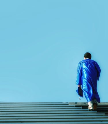 a man in a blue suit walking up stairs