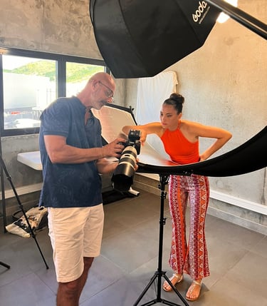 Portrait photographer sharing recent shots with the model during a studio session