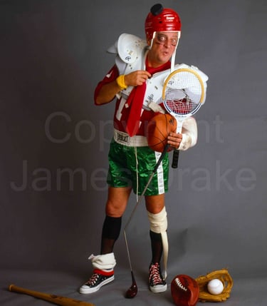 Actor and comedian Rodney Dangerfield poses with sports equipment in 1983 by James Drake