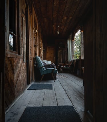 a chair in a room with a chair and a rug
