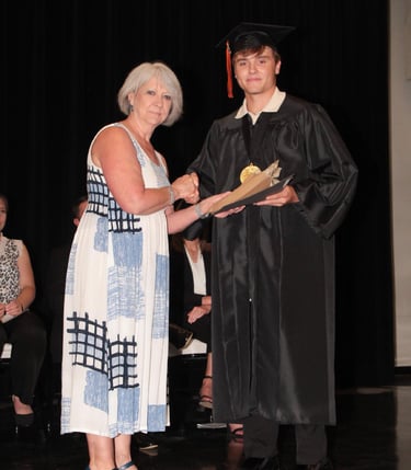 Young man in a graduation cap and gown