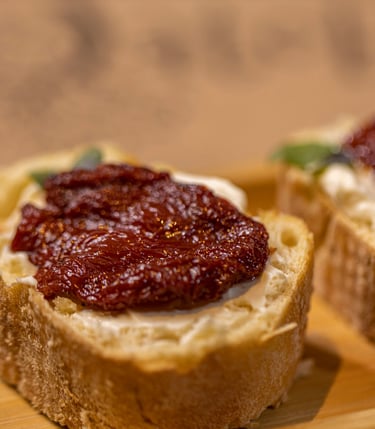 a couple of breaded breads with jam jams on them