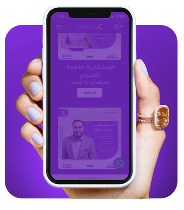 a person holding a phone with a purple background