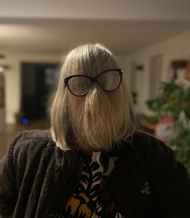 Funny face of women with hair in  front of face but behind glasses