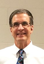 a man in a white shirt and tie 