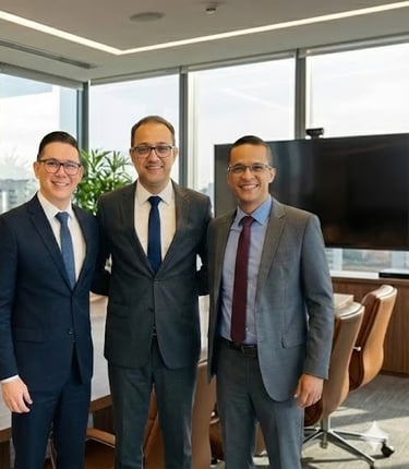 two men in suits standing in a conference room