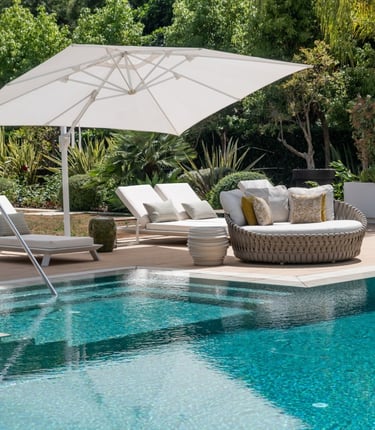 Pool area at Villa Serenity featuring modern furnishings, sunbathing lounges, and chill-out areas