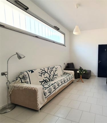 a couch with a tv and a television