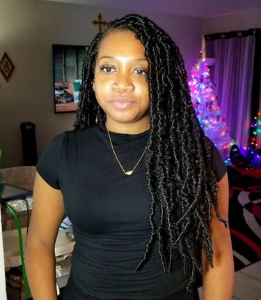 a woman with long black locs 