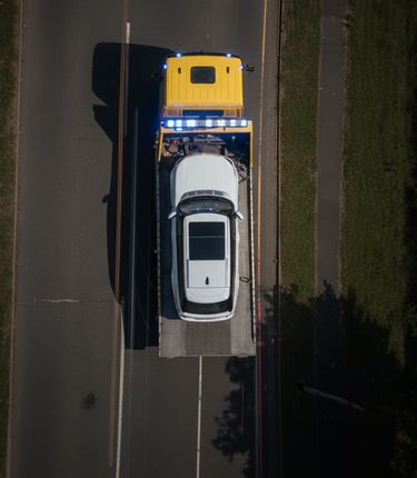 Recovery Truck towed Vehicle on Road