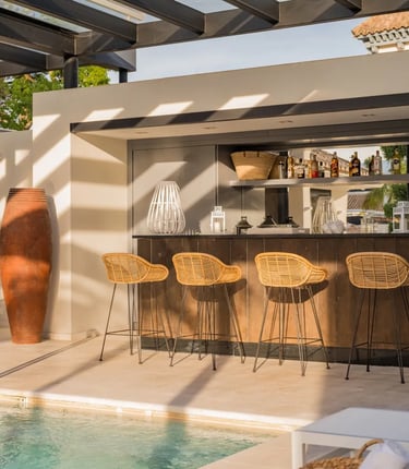 Outdoor bar and lounge area by the pool at Villa El Olivo, Marbella