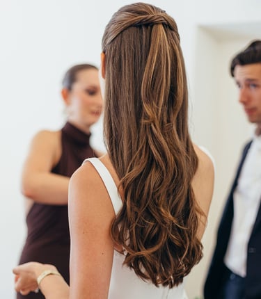 Beautiful long hair styled into half up half down hairstyle