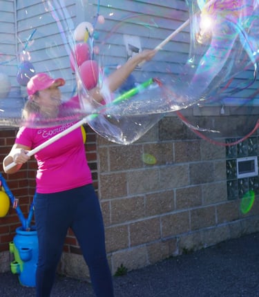Bubble attendant making bubbles at a party