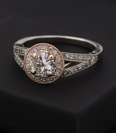 silver diamond halo ring on black box
