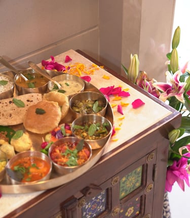 Authentic Gujarati thali at a Pune restaurant with traditional vegetarian dishes, curries, and sweet