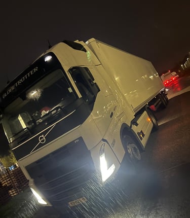 a truck with a white truck parked in front of it