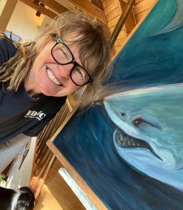 artist with shark painting
