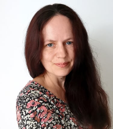 a woman with long hair and blue eyes