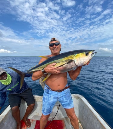 Anglers celebrating a successful yellowfin tuna catch in Makunduchi.