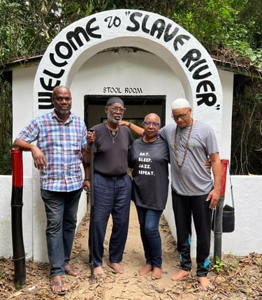 three men standing in front of a sign that says welcome to share rice