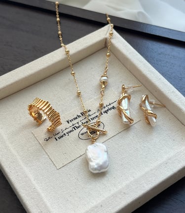 a necklace with a pearl necklace and a pearl necklace