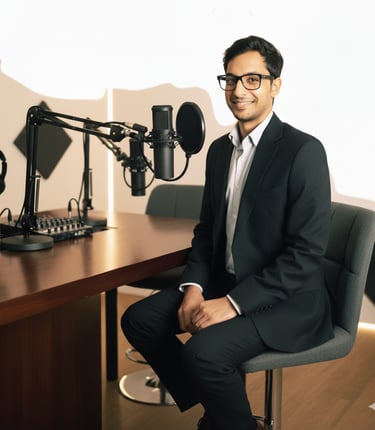 Ravi Saraf, founder of Infinity Property Consulting, sits at a modern podcasting desk