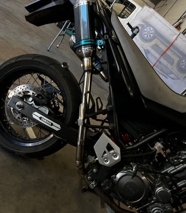 a motorcycle parked in a garage with a motorcycle
