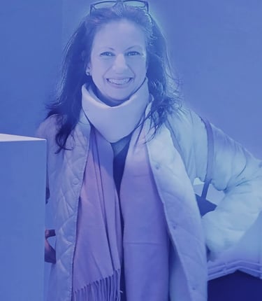 a woman in a white jacket and scarf