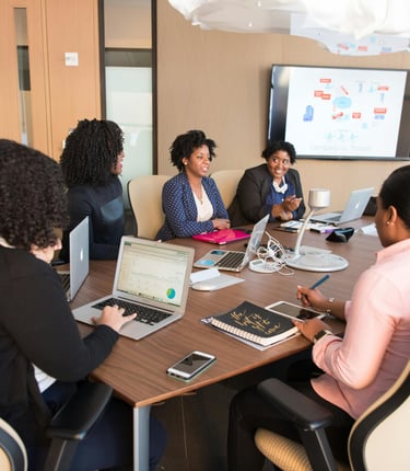 Conference room meeting with 5 people