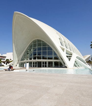 A vibrant university campus in Valencia with students chatting and walking around.