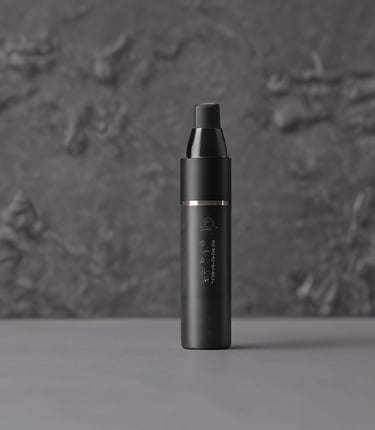 A close-up of hands stitching a sleek, modern jacket in a bright, airy studio.