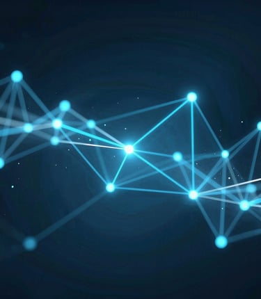 A friendly team collaborating over website designs in a bright, modern office space.