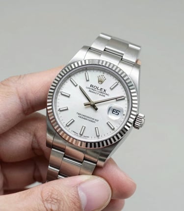 A skilled appraiser carefully examining a vintage silver necklace under bright light.