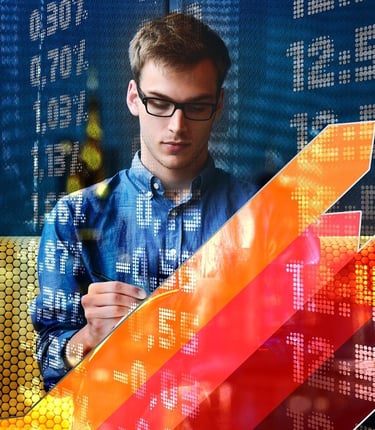 A male financial analyst tracking stock market growth data with rising arrow graphs and digital trading displays.