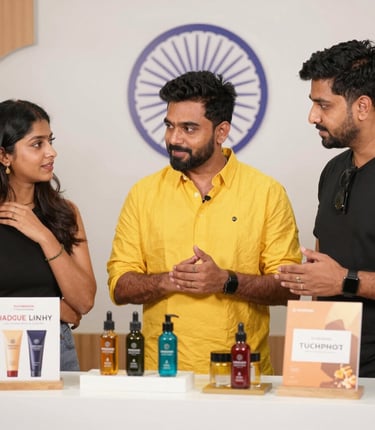 A vibrant workspace showing a brand manager and an influencer discussing a campaign over a laptop.