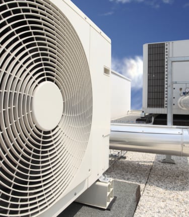 a couple of air conditioning units on a roof top