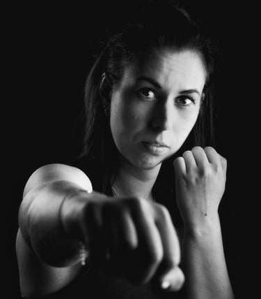 a woman in a black and white photo storytelling boxing