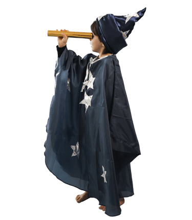 Young boy dressed like a wizard looking at the stars