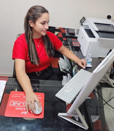 Fast Tire Shop customer service representative assisting clients at the front desk in East Los Angel