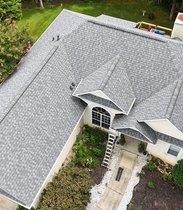 a house with a roof that has a gray roof