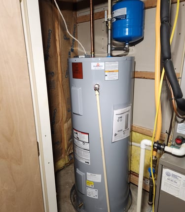 Newly installed electric water heater with safety valve in Rockville, MD residence