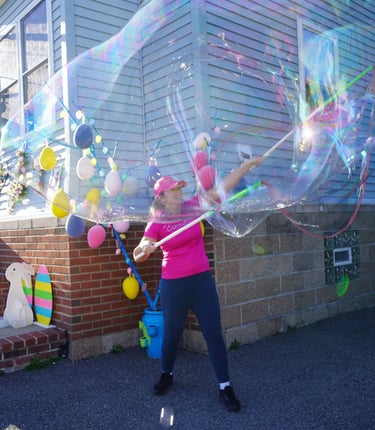 Bubble attendant making bubbles at a party