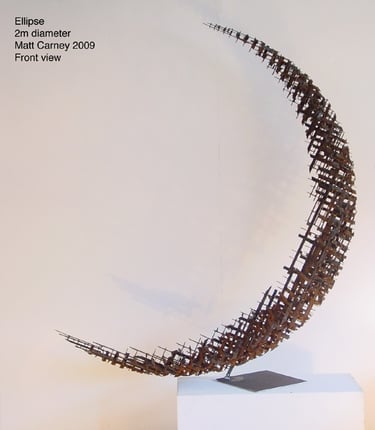 a rusted steel cross-hatched crescent shaped sculpture